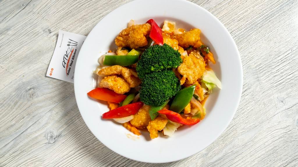 Thai Chili Fish · Crispy white fish with chili sauce, onions, bell peppers, basil leaves served with mixed veggies.