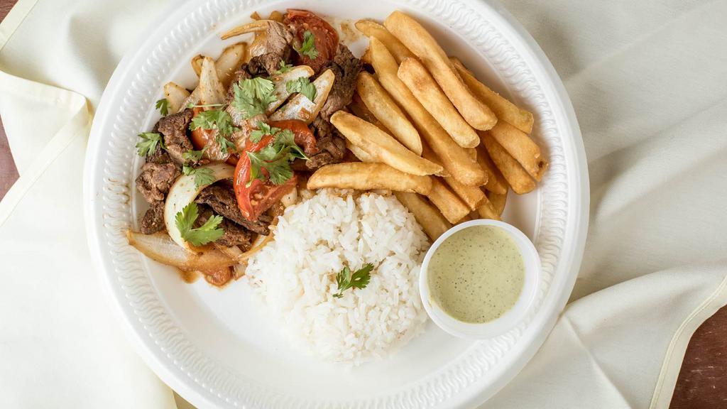 🥩 Lomo Saltado · Sautéed beef, tomatoes, and onions seasoned with French fries and white rice.