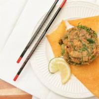 Tuna Tartare · Tuna, avocado, spicy sauce and seaweed salad.