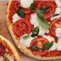 Margherita Pizza · Fresh mozzarella, garlic, fresh basil, romano cheese, tomato.