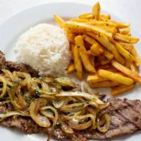 Palomilla · Grilled palomilla steak served with sautéed onions, cilantro and lime juice with garlic Fren...