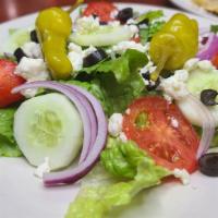 Greek Salad · Romaine lettuce, tomatoes, cucumbers, red onions, black olives, feta cheese, and pepperoncin...