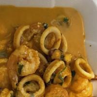 Picante De Mariscos · Chef's choice, shrimp, calamari and octopus in special sauce. Served with rice.