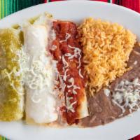 Enchiladas Plate (3) · Your choice of cheese, chicken or beef smothered in red sauce. Served with beans and rice.