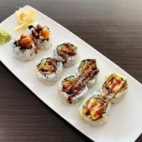 Spider Roll · Fried soft shell crab, cucumber, smelt roe and eel sauce.
