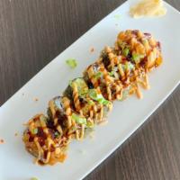 Volcano Roll · Crab meat, avocado and cucumber inside a deep fried roll topped with spicy tuna and special.
