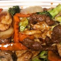 Triple Delight · Shrimp, chicken, beef sauteed with mushroom, bamboo shoots, sow peas, Chinese vegetables and...