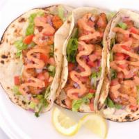 Gulf Shrimp Tacos · Three tacos filled w blackened, grilled or fried shrimp topped w cabbage, lettuce red onion ...