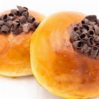 Chocolate Nutella Bun · A sweet but filled with a Nutella center, topped with charming chocolate shavings.