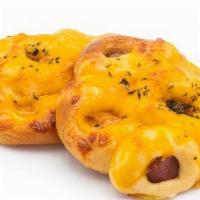 Hot Dog Cheese · Sausage rolled and baked in bread with three different cheeses.
