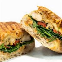 Chipotle Chicken Sandwich · Grilled chicken breast, baby spinach, roasted bell pepper, cilantro, and provolone cheese on...
