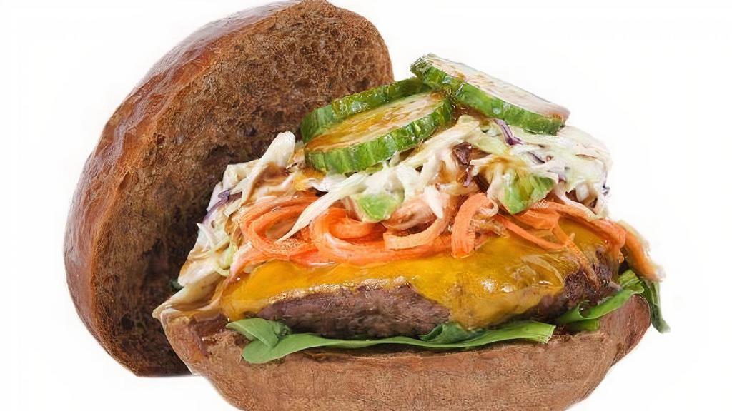 Sweet Hut Bulgogi Burger · Fresh Angus beef made with a Bulgogi sauce, cheddar cheese, pickled carrot, baby spinach, sliced cucumbers, our homemade slaw, and avocado topped with out organic whole wheat bun.