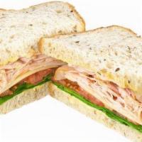 Turkey & Swiss Cold Sandwich · Smoked turkey, Swiss cheese, spinach, sliced tomato, mayonnaise, and Dijon mustard on our fr...