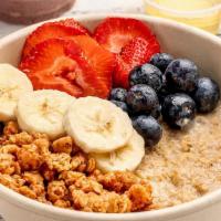 Oatmeal Bowl · Served with strawberry, banana, blueberry, honey.