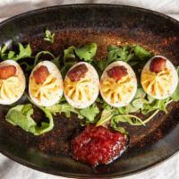 Deviled Eggs · Candied Bacon, Tomato Jam.