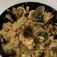 Paella Valenciana For One Person · Lobster tail, clams, calamari, shrimp, mussels, sautéed bell peppers, onions, Spanish sausag...