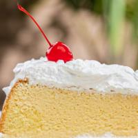 Tres Leches · Sponge cake soaked in three kinds of milks, topped with whipped cream.