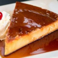 Flan · A delightful caramel custard coated with sweet syrup.