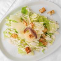Caesar Salad · Romaine lettuce topped with Caesar dressing, croutons, anchovies, and parmesan cheese.