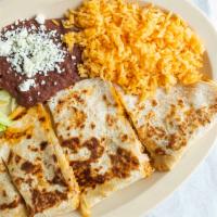 Quesadillas · Your choice of chicken or steak. Served with rice, beans and salad.