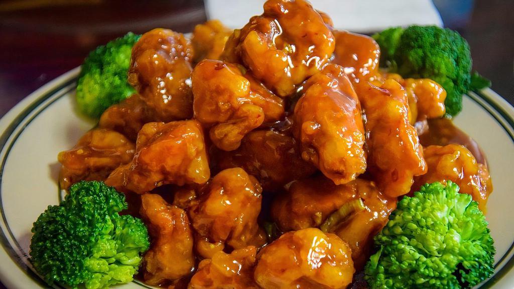 General Tso'S Chicken · Hot. Tender and crispy chicken with spicy glazed sauce served with steamed broccoli at the bottom.