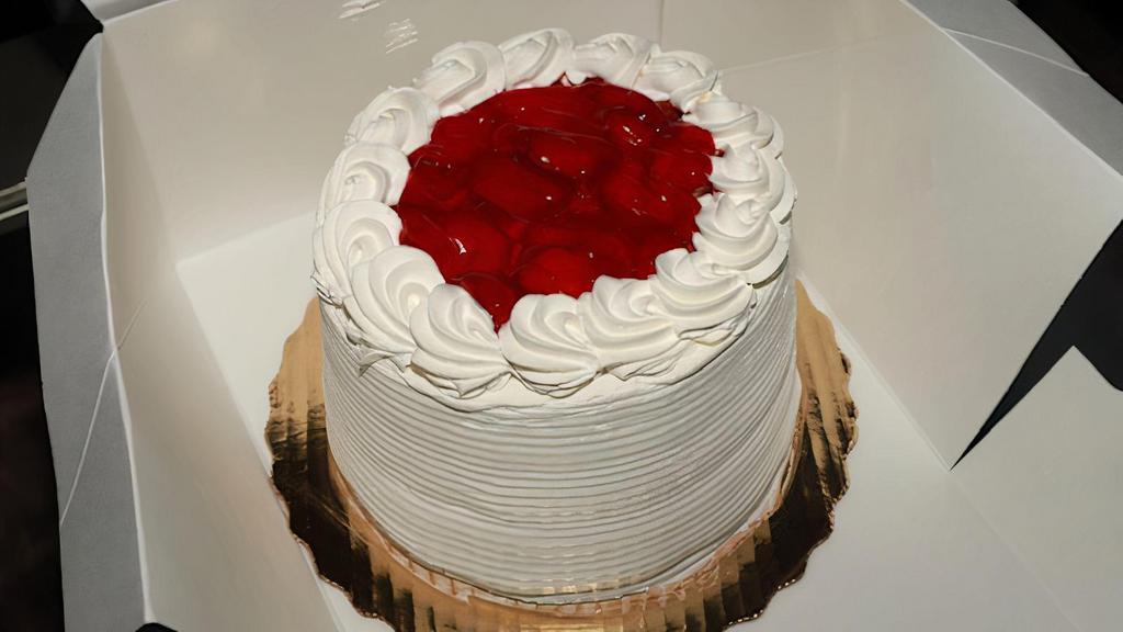 Strawberry Cake (Whole) · Vanilla cake with fresh strawberries and strawberry filling. Whipped topping Icing. Made fresh to order