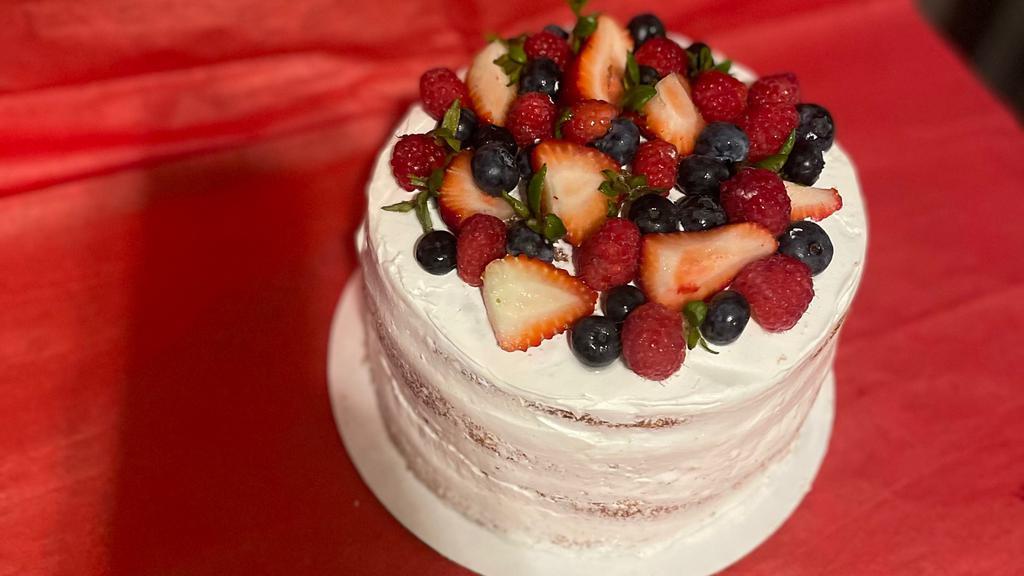 Naked Berry Cake · Vanilla whipped topping icing with vanilla cake. Filling…strawberries, blueberries and raspberries