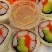 Naruto Maki Roll · Kanikama, masago, avocado wrapped in cucumber, served in rice vinegar and miso sauce.