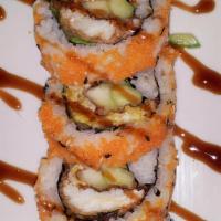 Spider Roll · Cooked. Soft shell crab tempura, cucumber, lettuce masago topped with eel sauce.