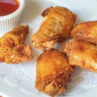 Thai Chicken Wings · Deep fried and served with a dipping sauce.