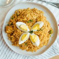 Chicken Biryanis · Baash-motee rice sauteed with chicken with special biriyani moshol-la and herbs.