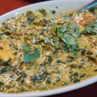 Shaag Ponir · Chopped 'paalong shaag' (spinach) prepared in a delightfully light cream sauce with cubed ho...