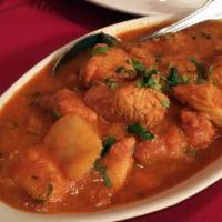 Chicken Vindaloo · Prepared with cubed potatoes in a very spicy turmeric sauce with a touch of fresh lemon juic...