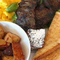 First Classic · Grilled skirt steak, two eggs any style, breakfast potato or grits, choice of toast.