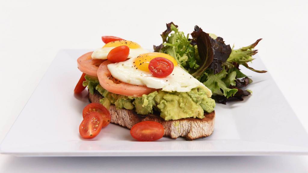 Jet Cafe'S Avocado Toast · Sunny-side up egg, vine ripe tomato, rustic toast, breakfast potatoes or grits.