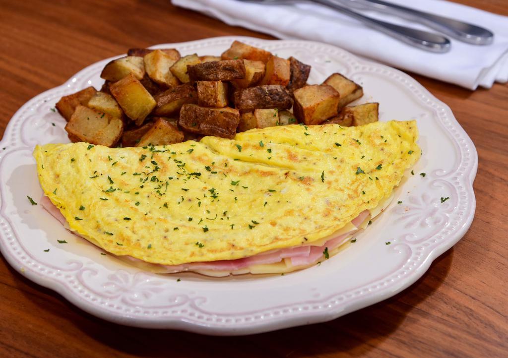 Omelette Ham & Cheese Potatoes · Served with roasted potatoes.