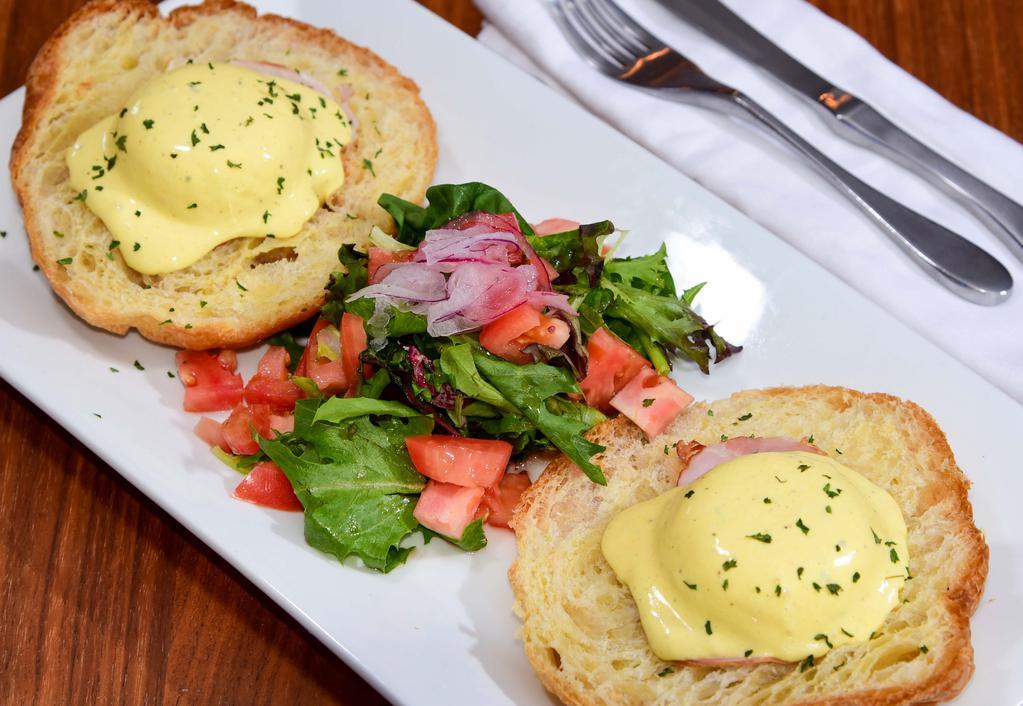  Eggs Benedict Croissant · New. Poached egg on a croissant, Canadian bacon, hollandaise sauce, spring mix salad.