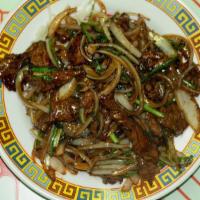 Mongolian · Shown above is the mongolian beef with green onions, white onions, crispy rice noodles serve...