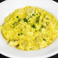 Curry Chicken Risotto · Four cheese and fresh herbs creamy sauce with a touch of pesto, toasted curry and diced loca...