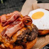 Messy Royale Burger · Dry-aged Brisket double patties, bacon, cheddar, fried egg, tomato, lettuce, house pickles, ...