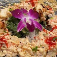 Volcano Roll · California roll top with baked seafood mayonnaise. The consumption of raw or undercooked foo...
