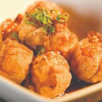 Shrimp Shumai · Seven pieces. Steamed or fried shrimp shumai, scallions, and sesame seeds. Served with japan...
