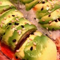 Dragon Roll · Shrimp tempura, imitation crab, cucumber, inside out with masago, and sesame seeds, topped w...
