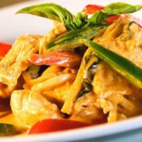 Red Curry · Thai red curry paste, coconut milk, bamboo shoots, bell peppers, and sweet basil. Served wit...