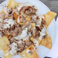 Bbq Nachos · Pork with Chips and queso.