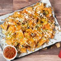 Brewery Nachos · Corn tortilla chips piled with red beans, black olives, tomatoes jalapeños, pepper jack and ...