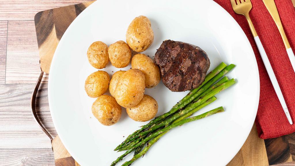 Hand-Cut Filet Mignon† · Grilled 6 oz. filet served with mini russet potatoes and grilled asparagus