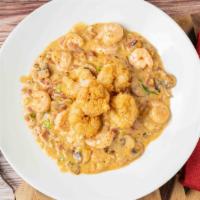 Shrimp & Grits · Sautéed shrimp with bacon, garlic mushrooms and scallions over cheddar and pepper jack grits...