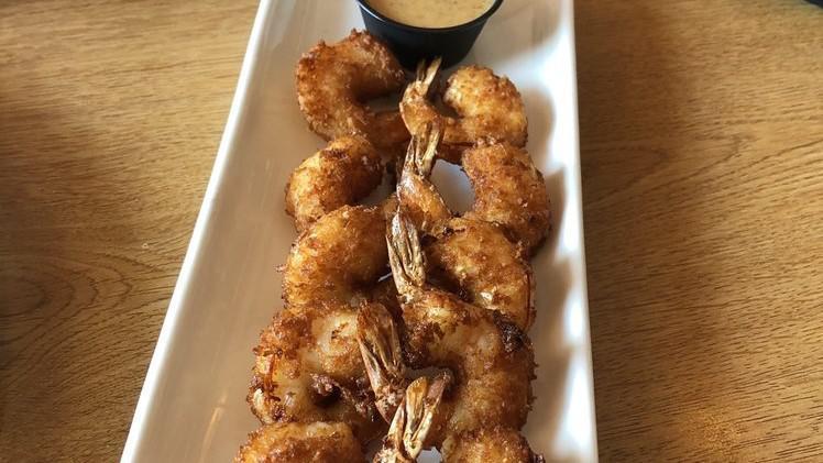 Ragtime Shrimp · Beer-battered shrimp, rolled in flaked coconut and fried, giving it a crunchy sweet flavor served with our signature honey mustard sauce, red beans and rice and vegetables.