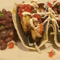 Shrimp Tacos · Royal Red shrimp in crisp blue
corn tortillas, wrapped in
soft flour tortillas with lettuce,...